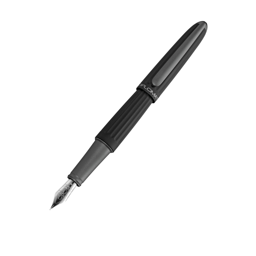 "Luxury Black Diplomat Aero fountain pen, inspired by aeronautical design, featuring a sleek anodized aluminum body with grooved lines and a glossy metallic finish. Available in multiple colors, the pen has a streamlined, Zeppelin-inspired shape, a slender clip with Diplomat’s logo, and a comfortable grip with smooth operation. Known for its elegance and durability, this high-end writing instrument is suitable for collectors and professionals seeking style and performance."