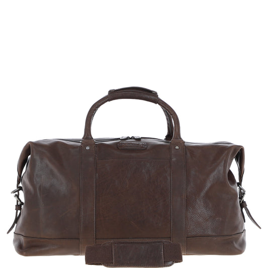 "Men’s brown genuine leather holdall bag by Ashwood, model Austin, designed for travel and weekend use. Features a rich, natural leather texture with top handles, a detachable shoulder strap, and exterior zip and slip pockets for easy access to essentials. The spacious, lined interior includes zip and slip pockets for organized storage. Durable and stylish, this versatile bag complements both casual and professional looks, ideal for short trips or daily use."