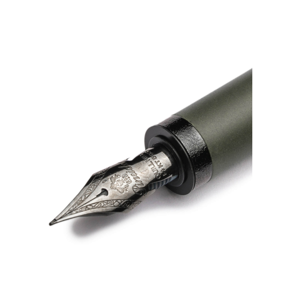 "Pineider Alchemist fountain pen in Krakatoa Green, crafted from a unique blend of zeolite and resin with a black-green finish and black trim. Features Pineider’s soft-touch magnetic lock cap, a black-plated stainless steel nib (size No.6), and includes an ink converter compatible with standard cartridges. Presented in a gift box, this luxury pen combines elegant design with volcanic-inspired materials, perfect for collectors and writing enthusiasts."