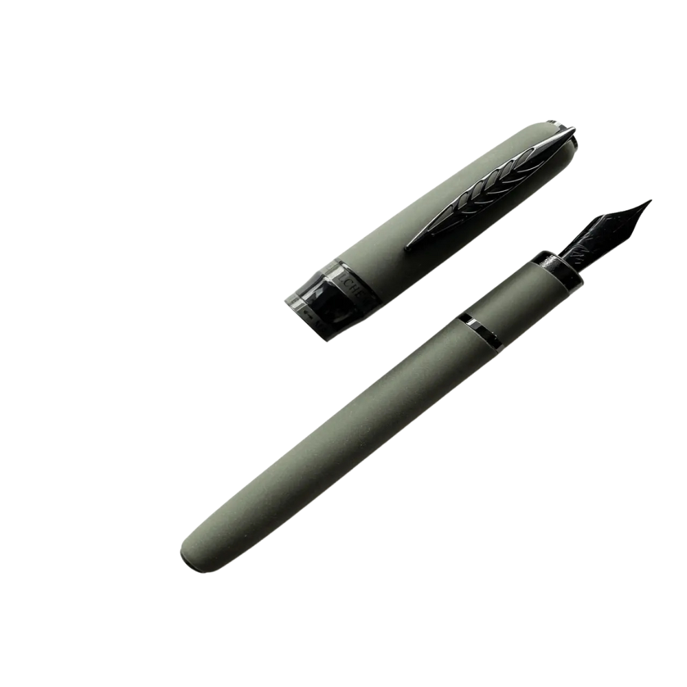 "Pineider Alchemist fountain pen in Krakatoa Green, crafted from a unique blend of zeolite and resin with a black-green finish and black trim. Features Pineider’s soft-touch magnetic lock cap, a black-plated stainless steel nib (size No.6), and includes an ink converter compatible with standard cartridges. Presented in a gift box, this luxury pen combines elegant design with volcanic-inspired materials, perfect for collectors and writing enthusiasts."